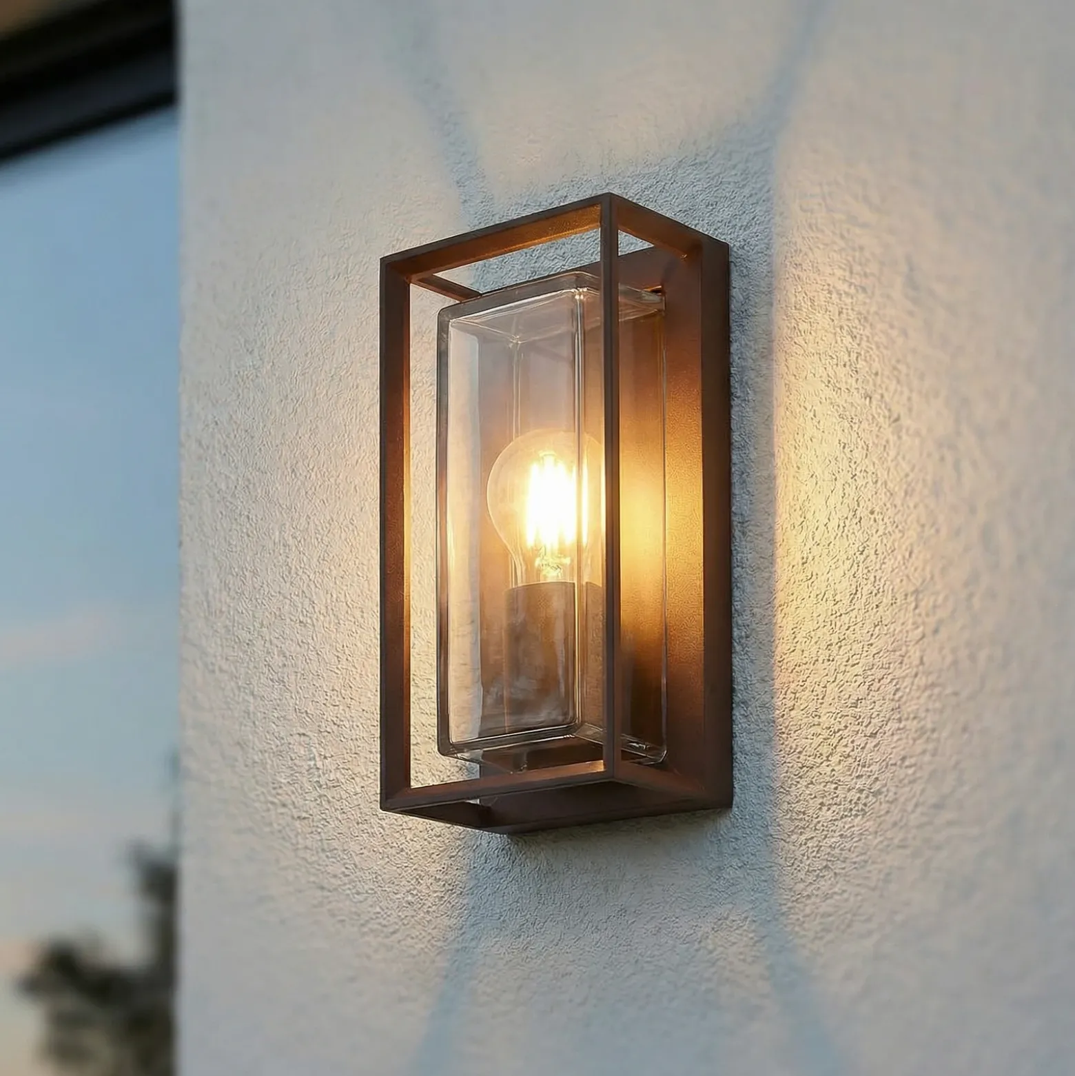 Aplique de exterior Arcchio Ismera, color óxido, IP65, cristal, E27