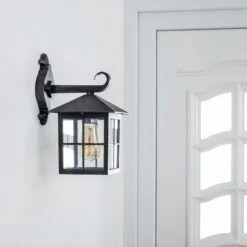 Aplique de exterior Ida de Lindby, color óxido, farol, 34 cm, E27