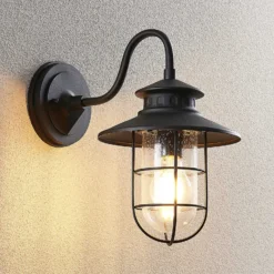 Aplique de exterior Lindby Kyan, altura 32 cm, negro, IP44, E27