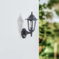 Aplique de exterior Lindby Nane, con sensor, farol, resistente al agua salada