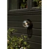 Aplique de exterior Nuura Liila, Ø 16 cm, negro/transparente