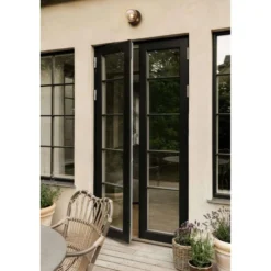 Aplique de exterior Nuura Liila, Ø 16 cm, bronce/transparente