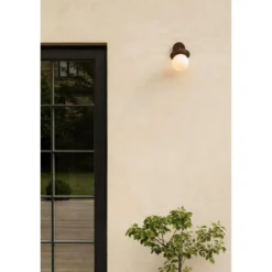 Aplique de exterior Nuura Liila, ancho 16 cm, bronce/ópalo