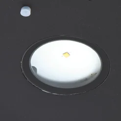 Aplique de pared LED solar Lucande Tavon, redondo, negro, sensor