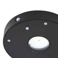 Aplique de pared LED solar Lucande Tavon, redondo, negro, sensor