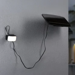 Aplique para exterior solar Paulmann Flotas, color antracita, con sensor, IP65