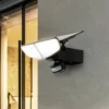 Aplique solar LED Lindby Naelin, negro, sensor, IP44