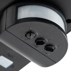 Aplique solar LED Lindby Naelin, negro, sensor, IP44