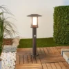 Baliza LED Pavlos de Lindby, 55 cm, color óxido, sensor