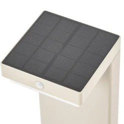 Baliza LED solar para zócalo Eleazar de Lindby, beige, aluminio, sensor