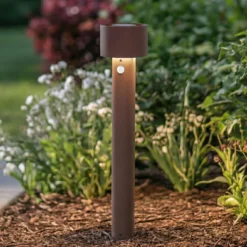 Bolardo luminoso LED Arcchio Milten, 65 cm, color óxido, IP65, con sensor