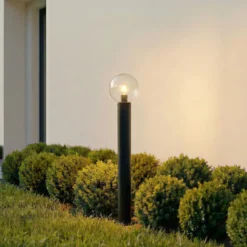 Bolardo luminoso Lindby Dangan, negro/transparente, altura 90 cm, cristal