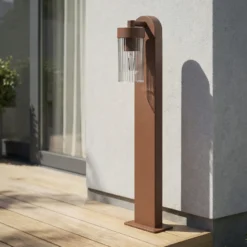 Bolardo luminoso Lindby Kaliro, óxido, 60 cm, E27, IP54