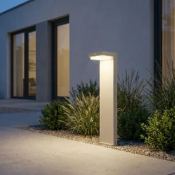 Lindby Baliza LED solar para zócalo Eleazar, blanca, aluminio, sensor