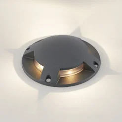 Lindby foco LED de suelo Cormac, 4 luces, Ø 21 cm, IP67