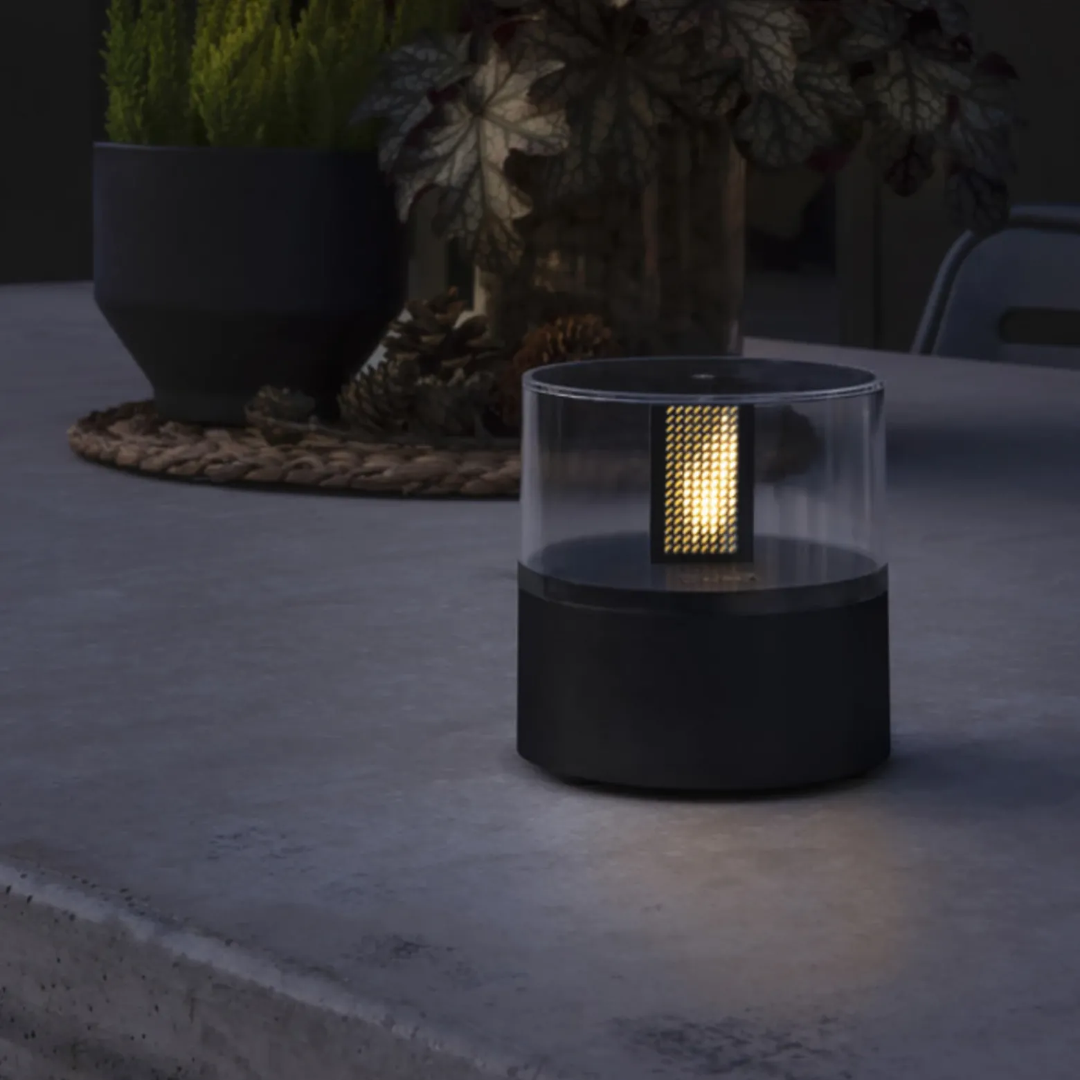 Lámpara decorativa con efecto llama, base negra
