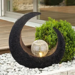 Lámpara decorativa LED solar de Lindby Adem, marrón rojizo, cristal, 31 cm