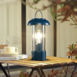 Lámpara de mesa LED recargable Lindby Yvette, azul, IP44, regulador táctil