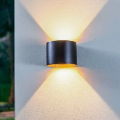 Lámpara de pared LED para exteriores Nivar de Lindby, redonda, negro/dorado,