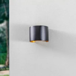 Lámpara de pared LED para exteriores Nivar de Lindby, redonda, negro/dorado,