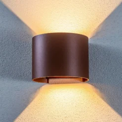Lámpara de pared LED para exteriores Nivar de Lindby, redonda, óxido, metal,