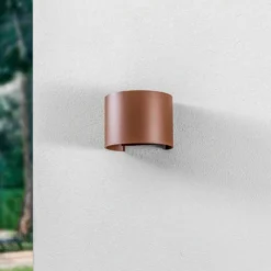 Lámpara de pared LED para exteriores Nivar de Lindby, redonda, óxido, metal,