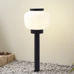Lámpara de pie Orfeas de Lindby, blanco/negro, aluminio, Ø 24 cm