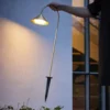 Lámpara LED con pica para suelo FRANDSEN Grasp, color latón, 82 cm, IP44