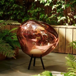 Lámpara LED recargable para terraza Melt grande de Tom Dixon, color cobre