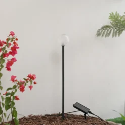 Lámpara LED solar Lindby Brindley, negra, cristal, IP65